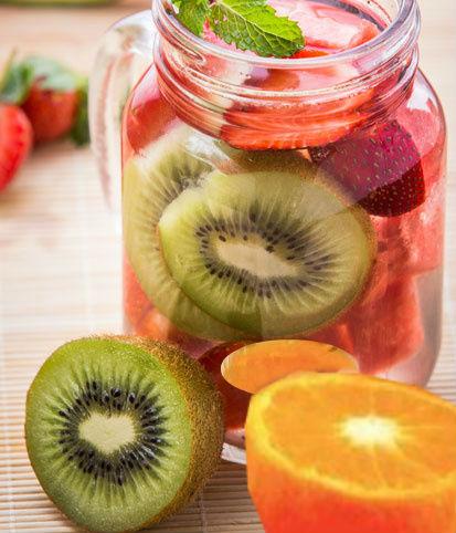 Detox water with strawberries, kiwi and orange